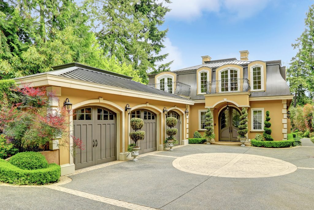 Luxury Home With Curved Metal Panels And Standing Seam Roofing