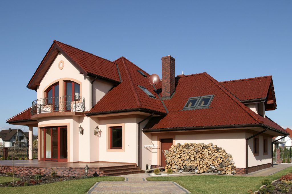 Red Metal Tile Roof On A Country Home