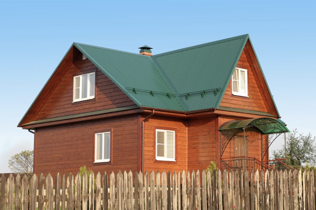 Wood Home With Green Metal Roof And Snow Guards